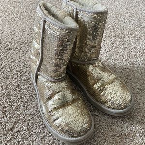 Well loved pair of gold sequin Ugg boots.